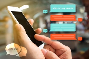 Chat bot and future marketing concept , Chatbot icon , Hand holding mobile phone with automatic chatbot message screen with abstract background